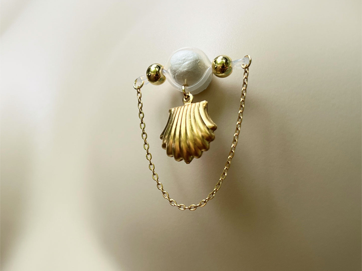 Golden Shell Charm with Nipple Chain on not pierced nipple barbell - Secretly Mine
