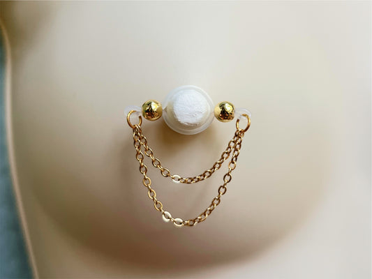Golden faux nipple piercing barbell style with two gold chains