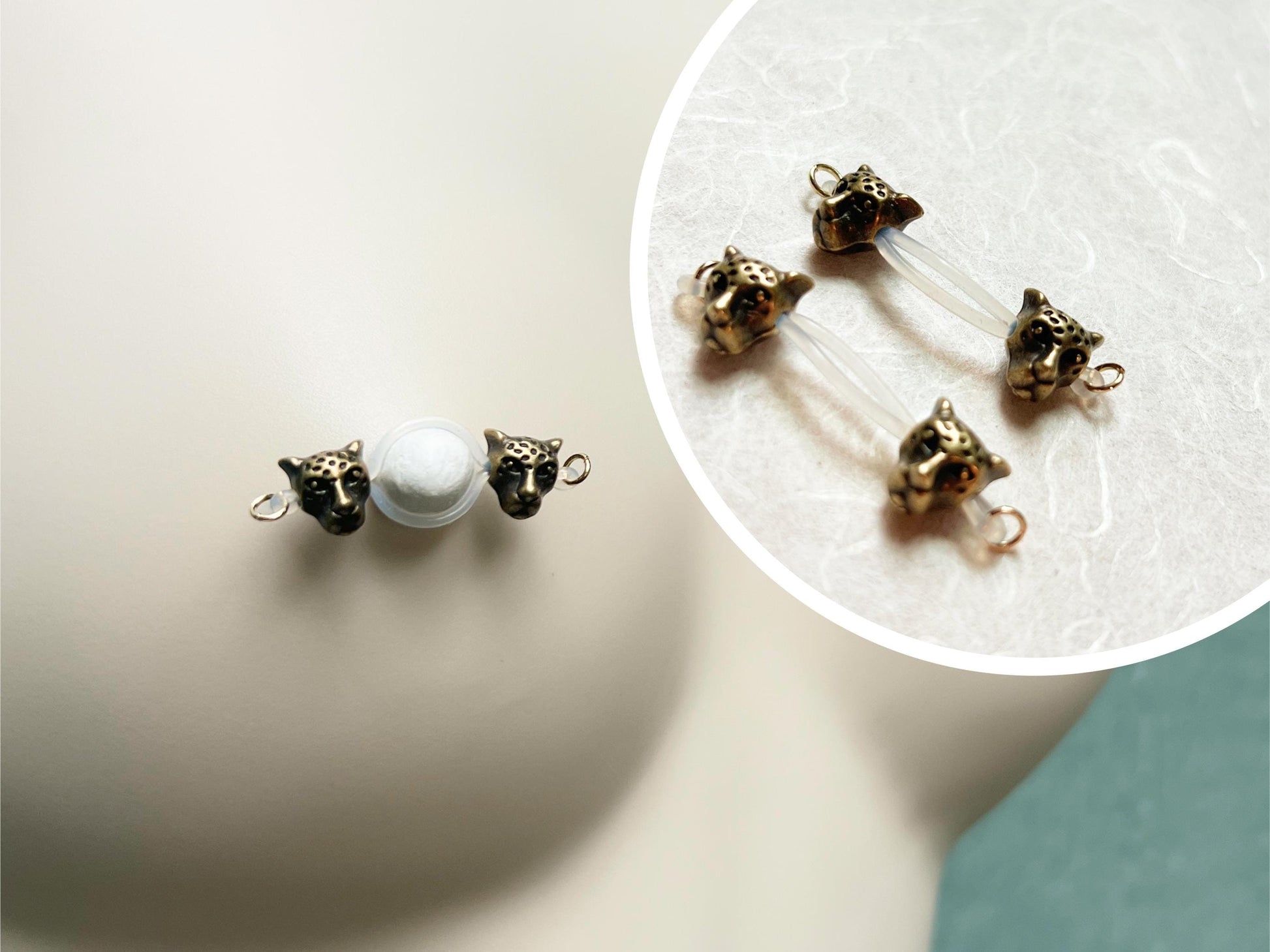 nipple jewelry with leopard heads, leopard barbell nipple piercing, fake nipple piercing with wild cats, cougar nipple jewelry